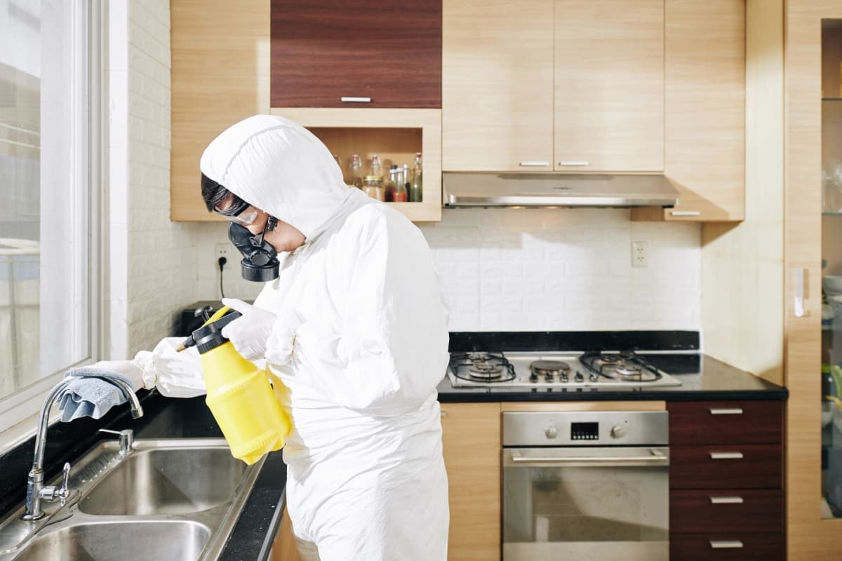Technician Cleaning Kitchen