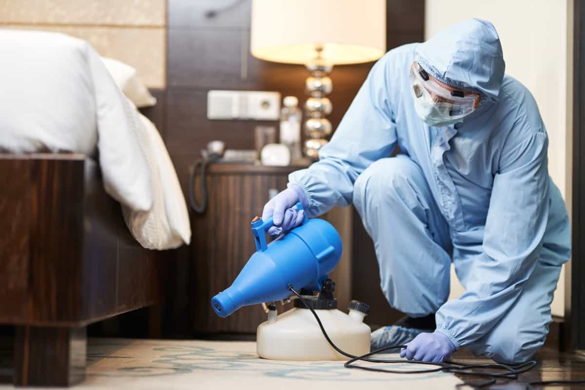 spraying disinfectants in the bedroom